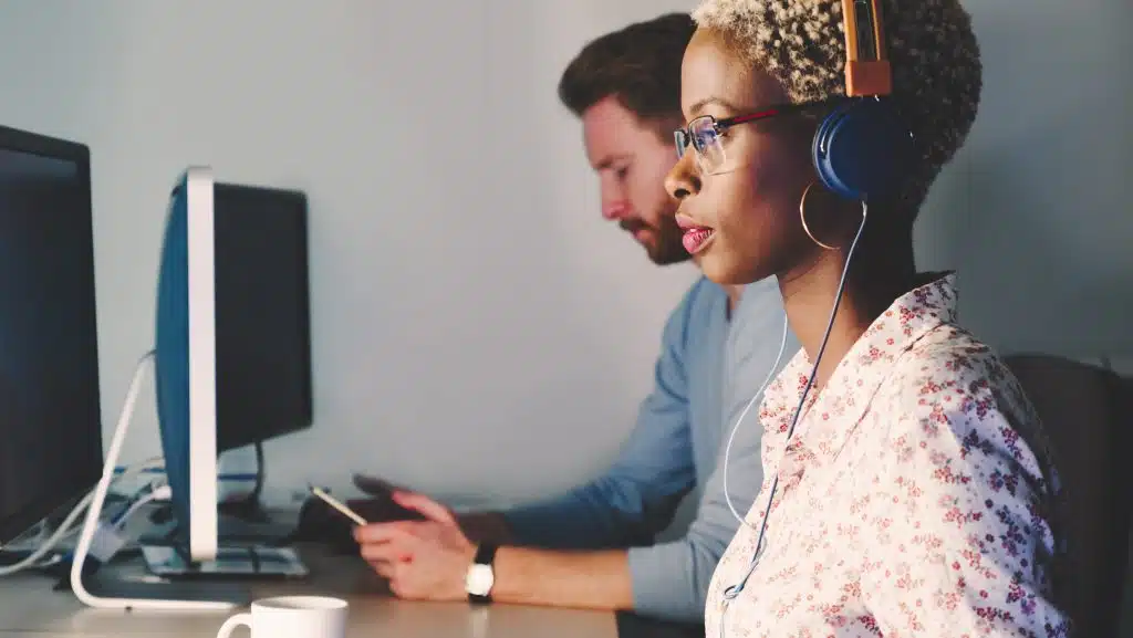 woman and man in front of computer